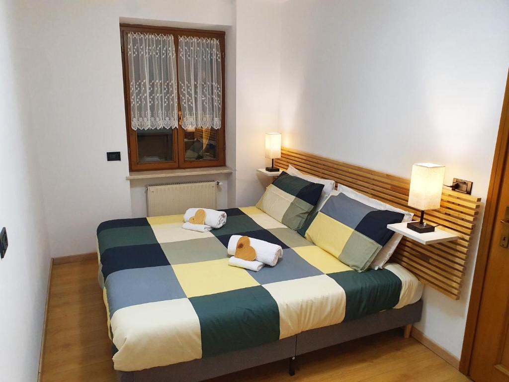 Postel nebo postele na pokoji v ubytování ElvesHome - Alpine Stay Apartments