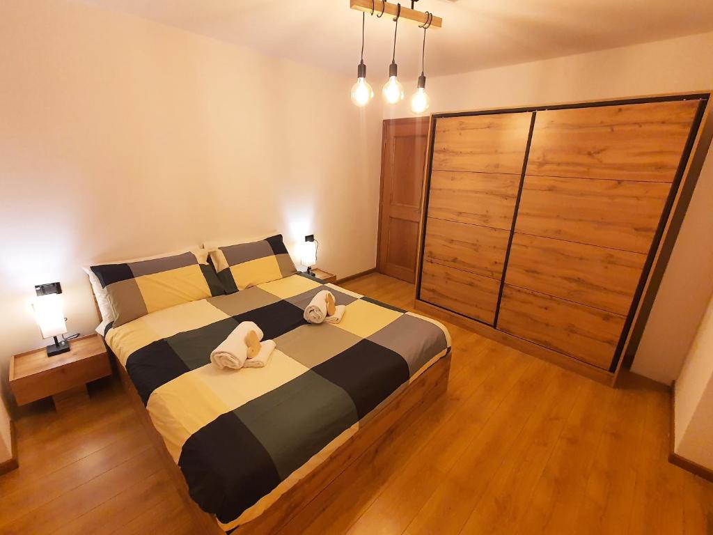 מיטה או מיטות בחדר ב-ElvesHome - Alpine Stay Apartments