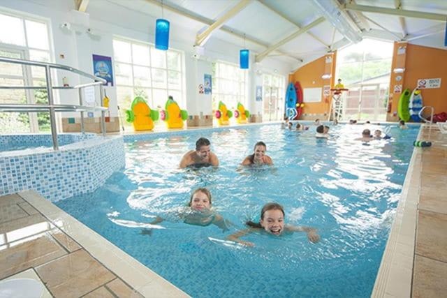 a group of people swimming in a swimming pool at Sun sea and sand at Whitley bay caravan park in Whitley Bay