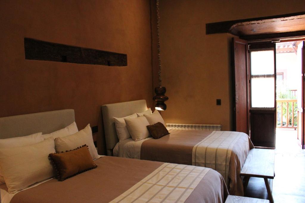 Postel nebo postele na pokoji v ubytování Hotel Ibarra 14