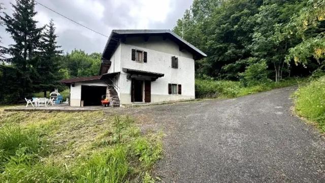 a large white house with a road in front of it at Vale House in Faidello