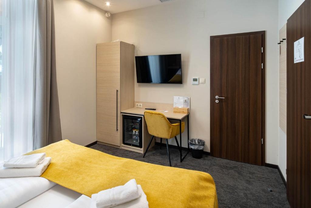 TV a/nebo společenská místnost v ubytování Inter Hotel