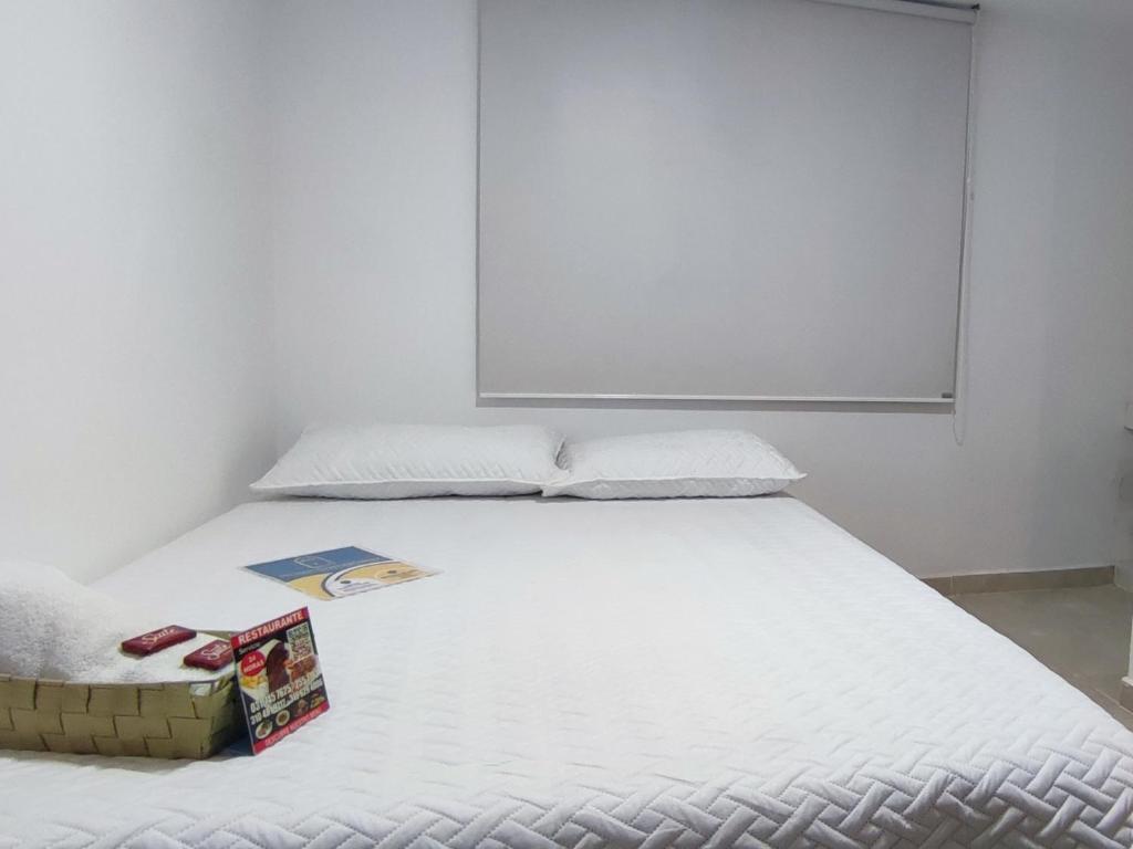 Postel nebo postele na pokoji v ubytování HOTEL CUMANDAY