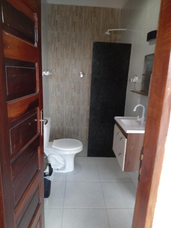 a bathroom with a toilet and a sink at Minha casa in Mossoró