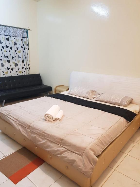 Postel nebo postele na pokoji v ubytování Bzxmax Guest House
