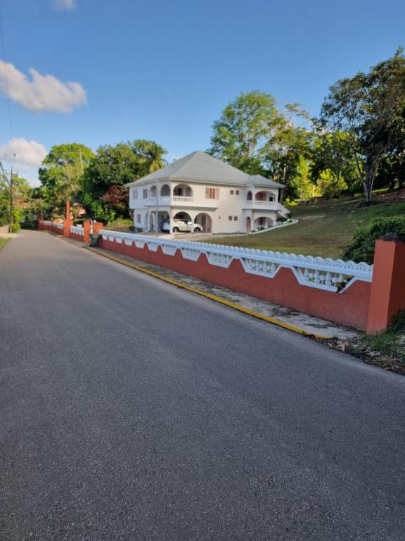 a house on the side of a road at Shaw Park Gem Apt 12D in Ocho Rios