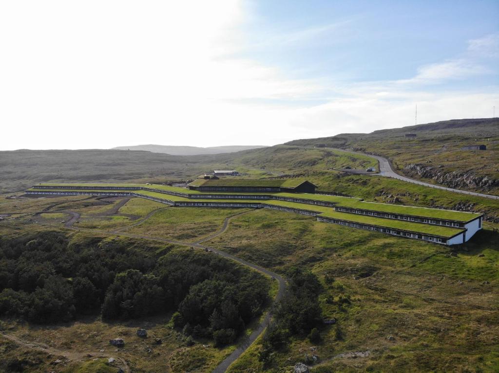 an aerial view of a building on a hill at Hotel Føroyar in Tórshavn