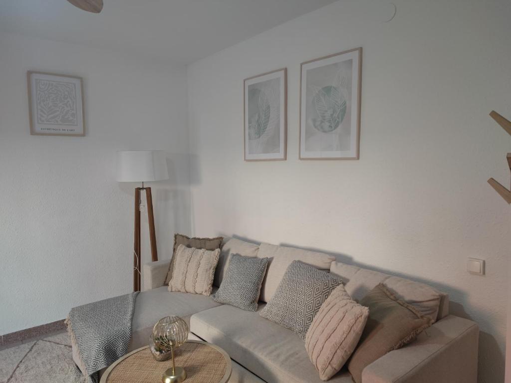 a living room with a couch and a table at Feel Welcome Barcelona 10 in Cornellà de Llobregat