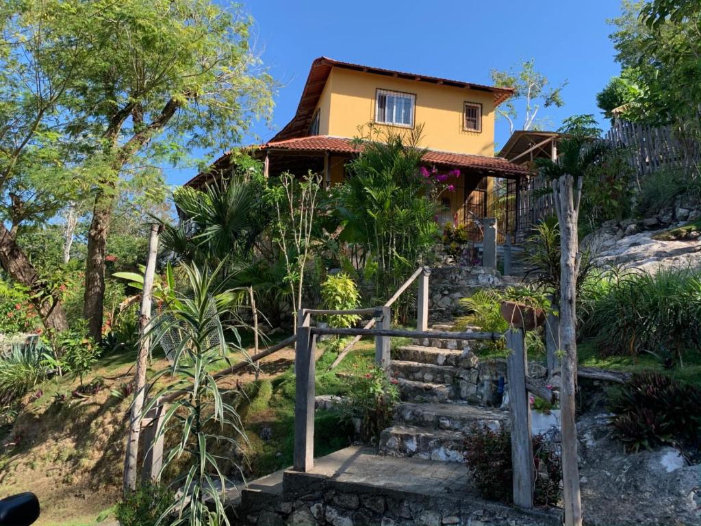 a house on a hill with stairs leading to it at Casa Alemán in Flores