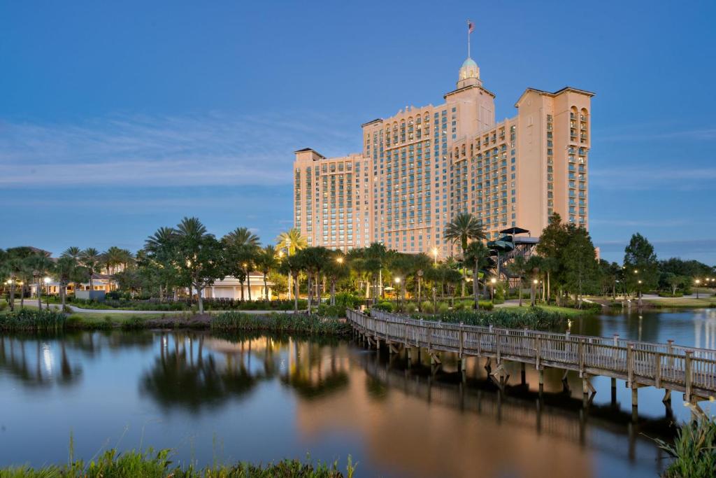 a bridge over a river in front of a large building at JW Marriott Orlando Grande Lakes in Orlando