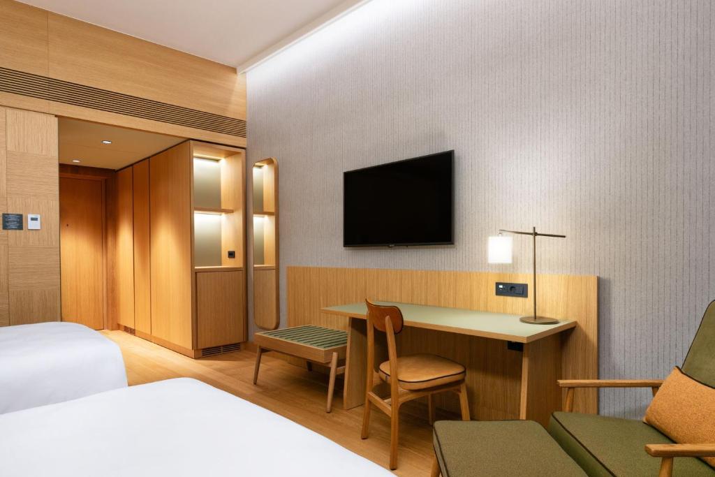 Postel nebo postele na pokoji v ubytování Four Points by Sheraton Ljubljana Mons