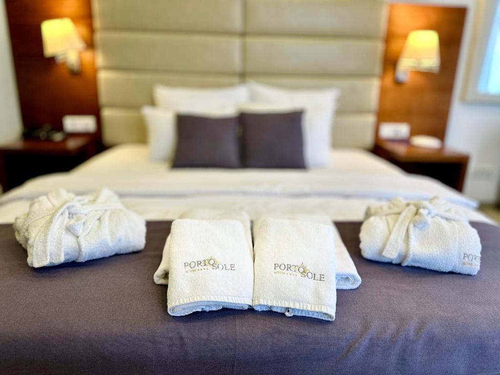 Кровать или кровати в номере Boutique Hotel Porto Sole