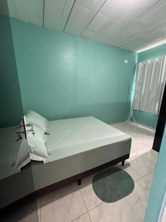 เตียงในห้องที่ Suite 2 - Green Praia bonita hospedagem
