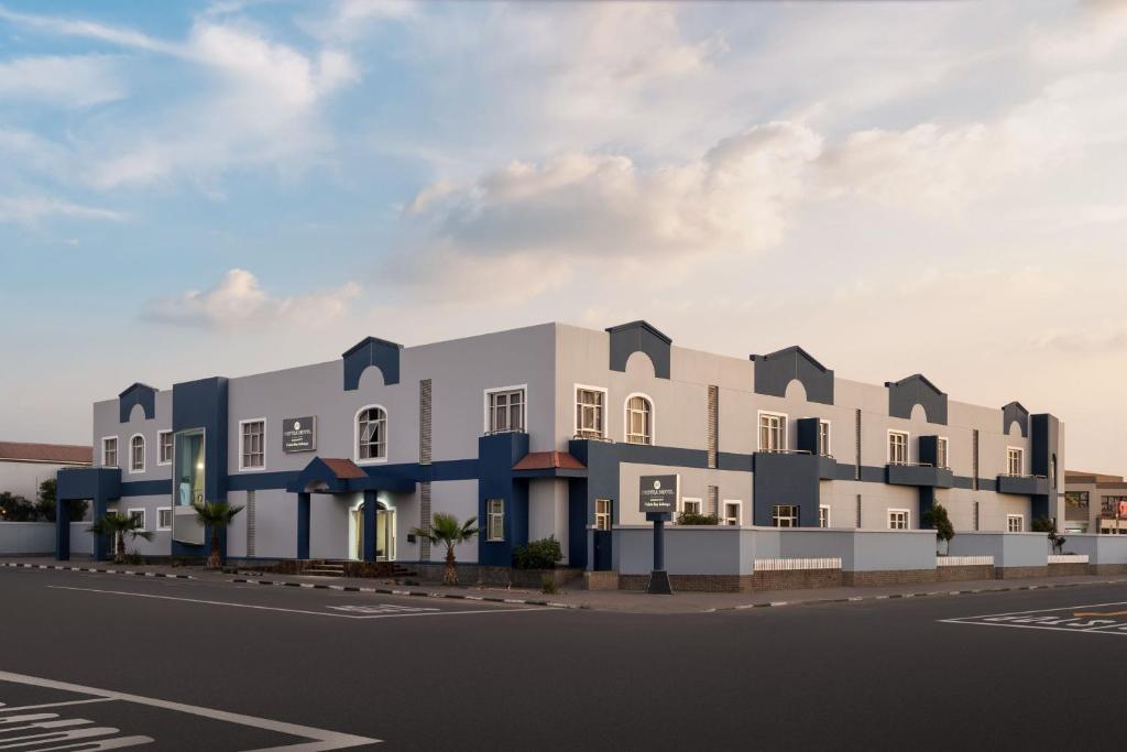 an architectural rendering of a building on a street at Protea Hotel by Marriott Walvis Bay Indongo in Walvis Bay