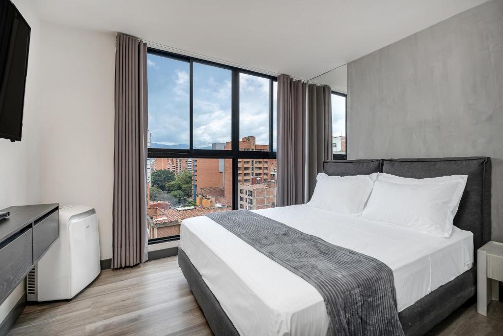 Postel nebo postele na pokoji v ubytování Apartamentos HOUSY Laureles