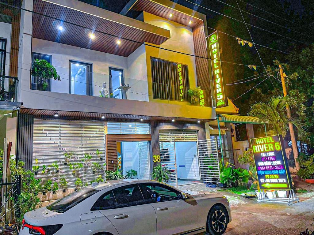 a car parked in front of a house at River Hotel 5 in Long Xuyên