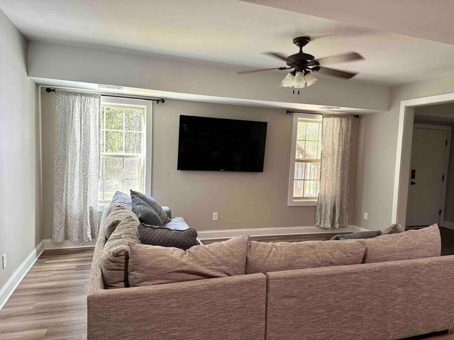 a living room with a couch and a flat screen tv at 2 BR 1 BA apartment in Newnan