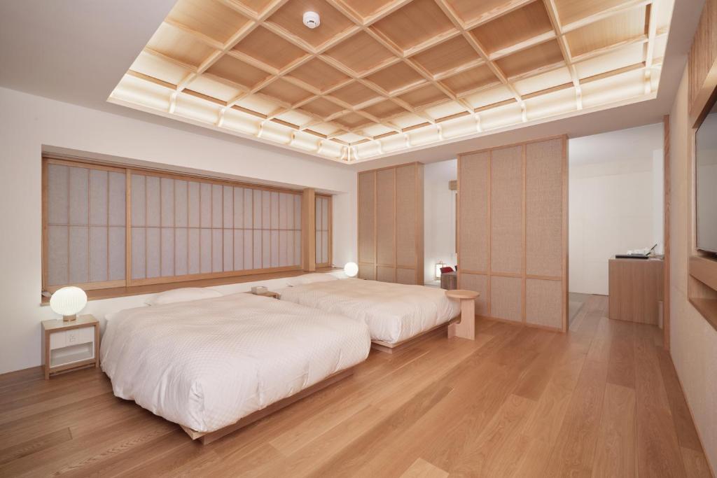Postel nebo postele na pokoji v ubytování HOTEL VMG RESORT KYOTO