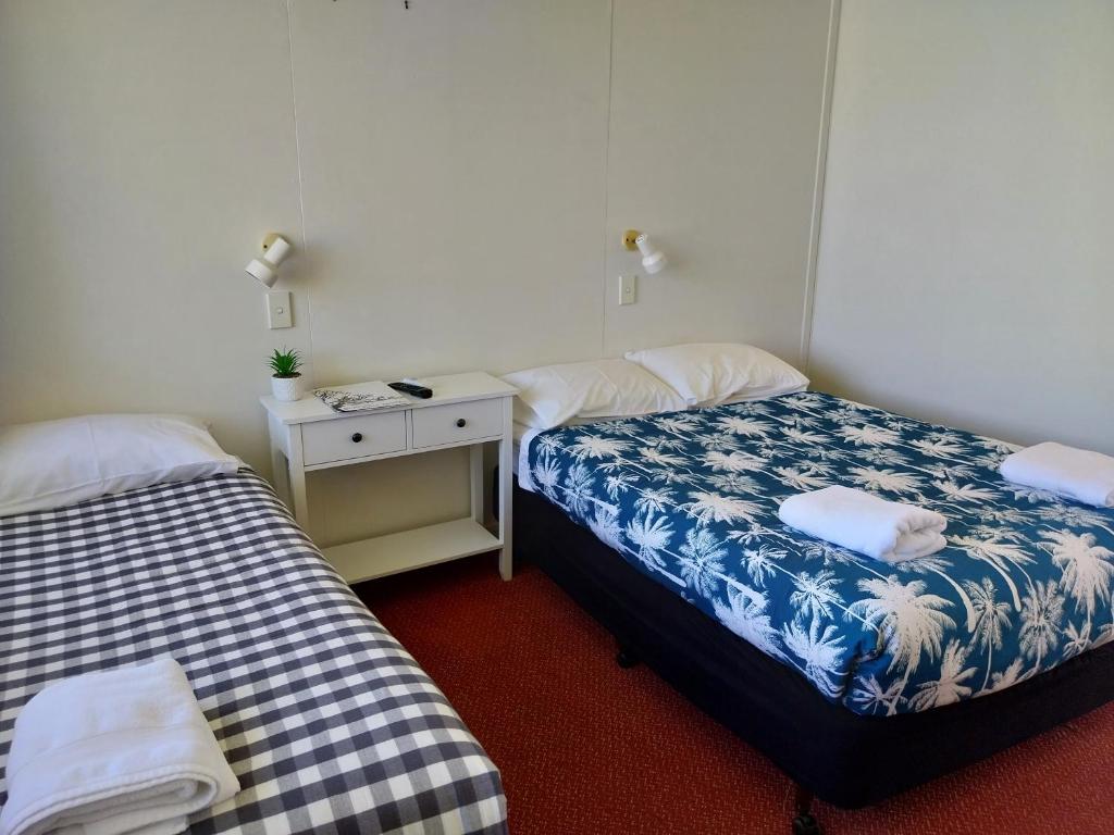 Postel nebo postele na pokoji v ubytování Motel Blackall