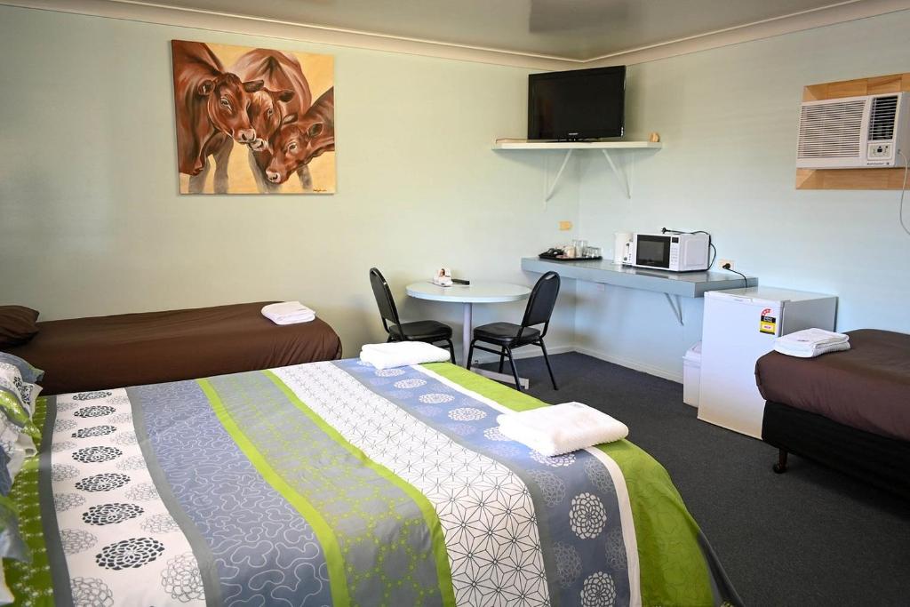Postel nebo postele na pokoji v ubytování Motel Blackall