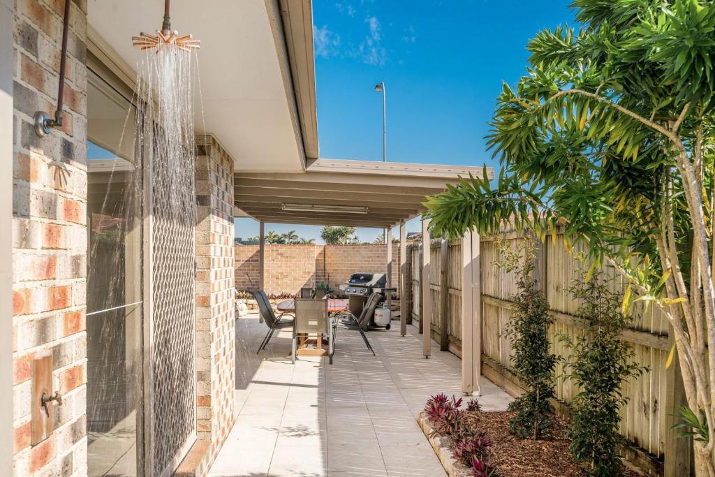 a walkway leading to the back of a house at The Terrace in East Ballina