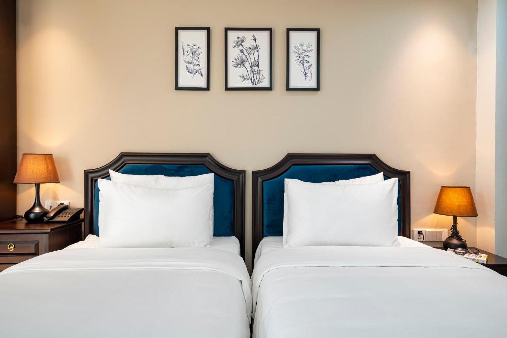Postel nebo postele na pokoji v ubytování Hanoi Fiesta Grand Hotel and Spa