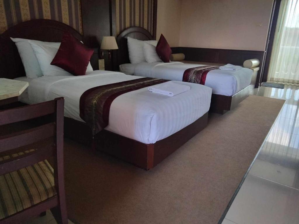 Cama o camas de una habitación en The Lion King Hotel Udonthani