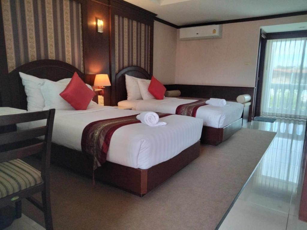 Cama o camas de una habitación en The Lion King Hotel Udonthani