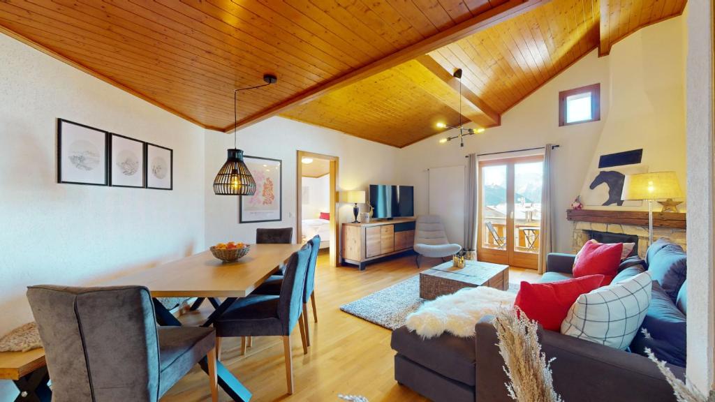 a living room with a couch and a table at No 8 Bed & Bar in Verbier
