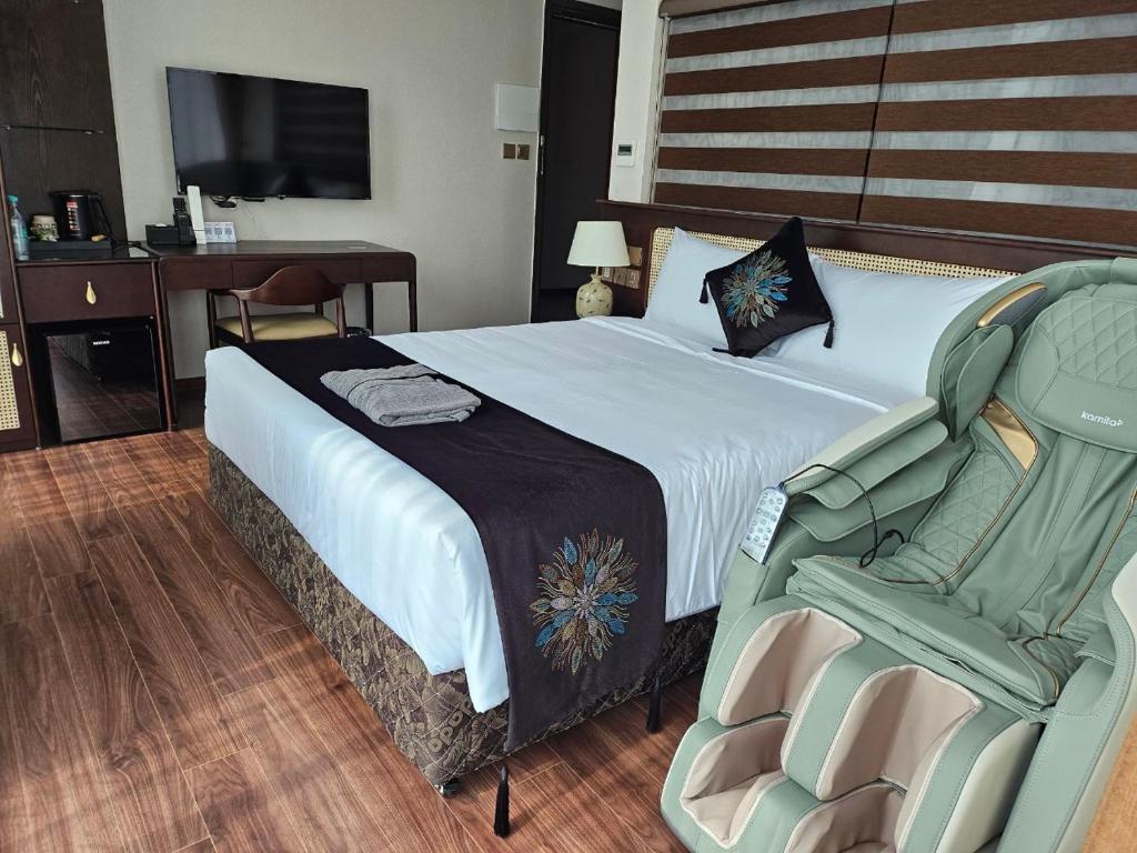Postel nebo postele na pokoji v ubytování MOMIZI HANOI 2 - PHAN KE BINH