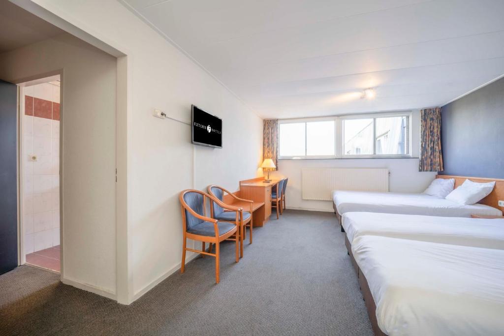 Postel nebo postele na pokoji v ubytování Fletcher Hotel-Restaurant Waalwijk