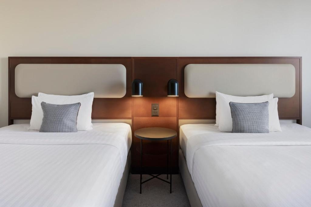 Postel nebo postele na pokoji v ubytování Courtyard by Marriott Basel