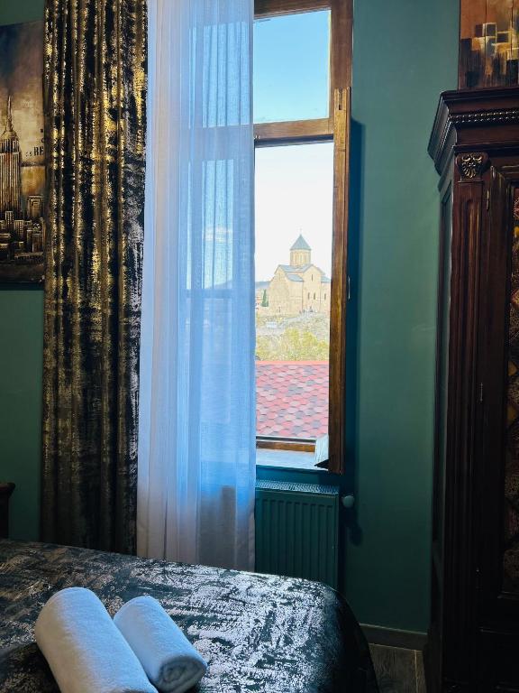 Postel nebo postele na pokoji v ubytování Hotel Zerta Old Tbilisi