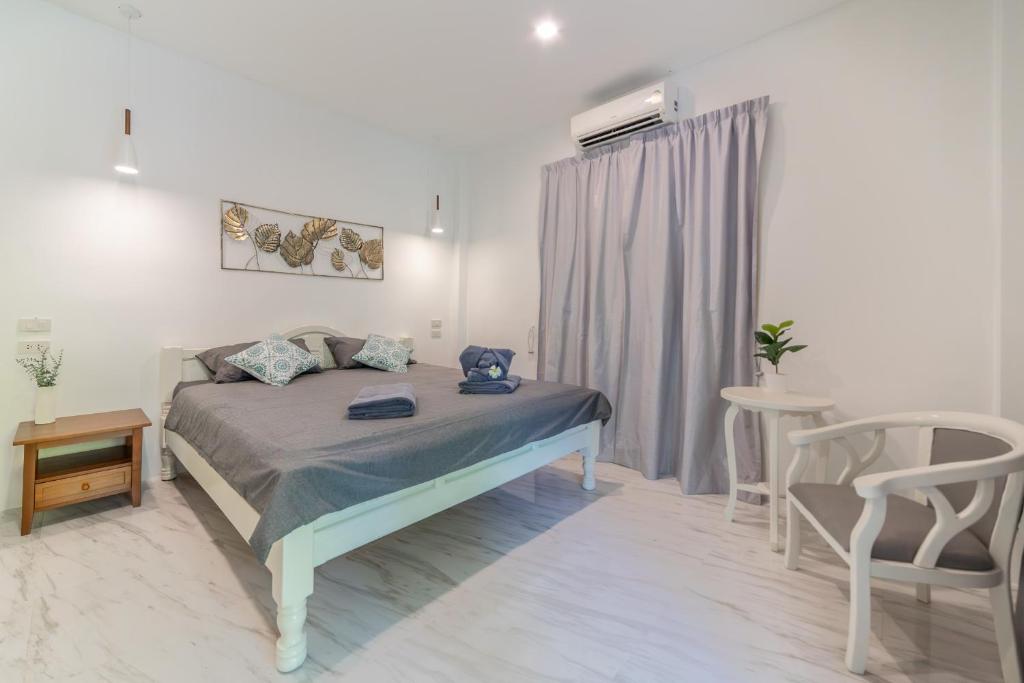 Postel nebo postele na pokoji v ubytování Apple Villas