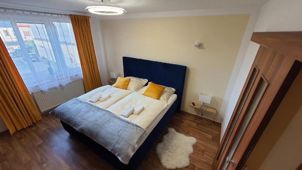 Postel nebo postele na pokoji v ubytování Apartmán U Pošty Králíky