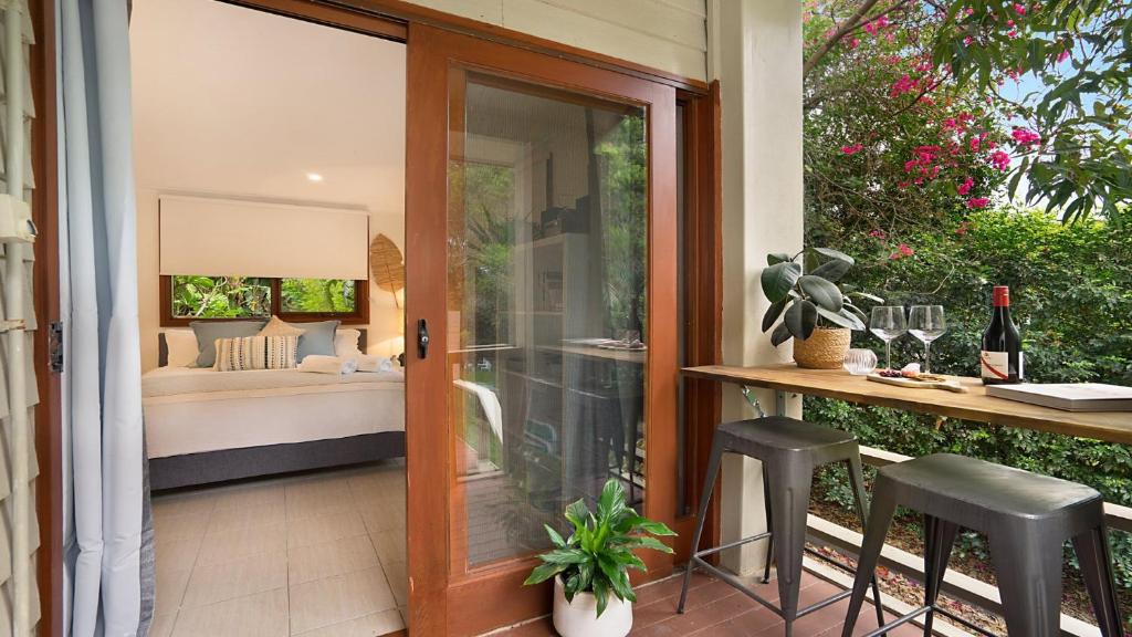 a patio with a door leading to a bedroom at MacMasters Studio Retreat in Macmasters Beach
