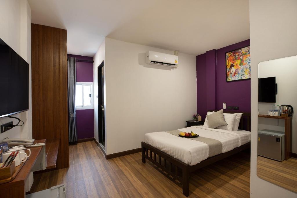 Postel nebo postele na pokoji v ubytování Aspira Resort Klong Muang Krabi