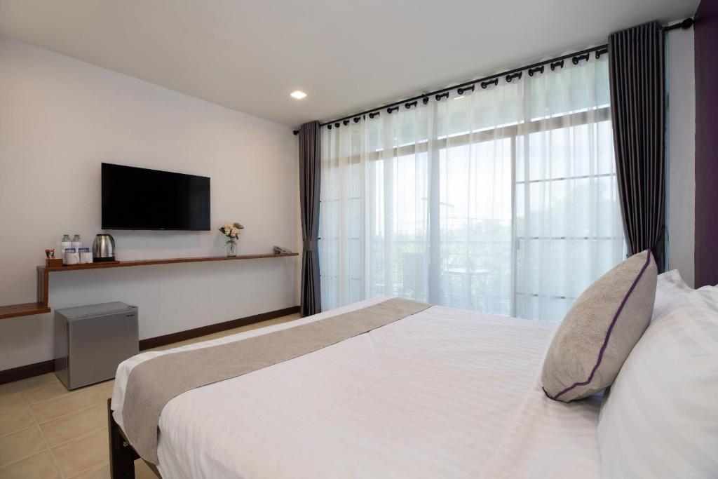Postel nebo postele na pokoji v ubytování Aspira Resort Klong Muang Krabi