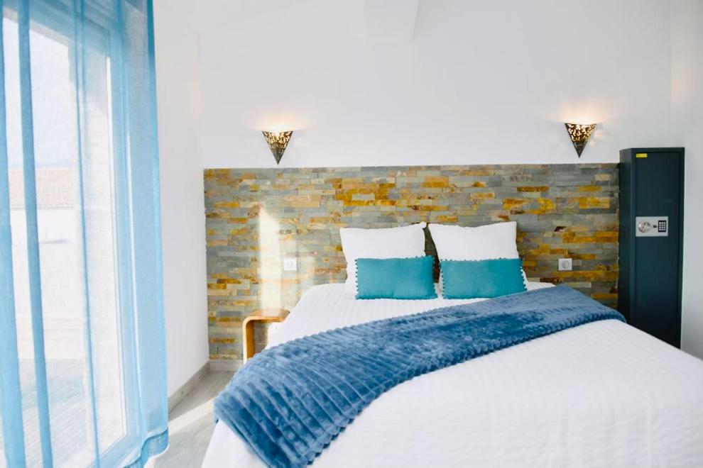Ένα ή περισσότερα κρεβάτια σε δωμάτιο στο Casa Serena