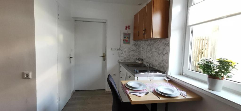 Kuchyň nebo kuchyňský kout v ubytování Apartma Lea