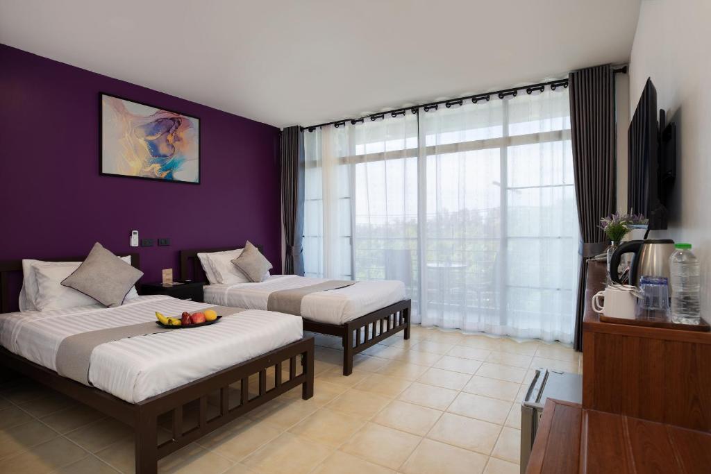 Postel nebo postele na pokoji v ubytování Aspira Resort Klong Muang Krabi