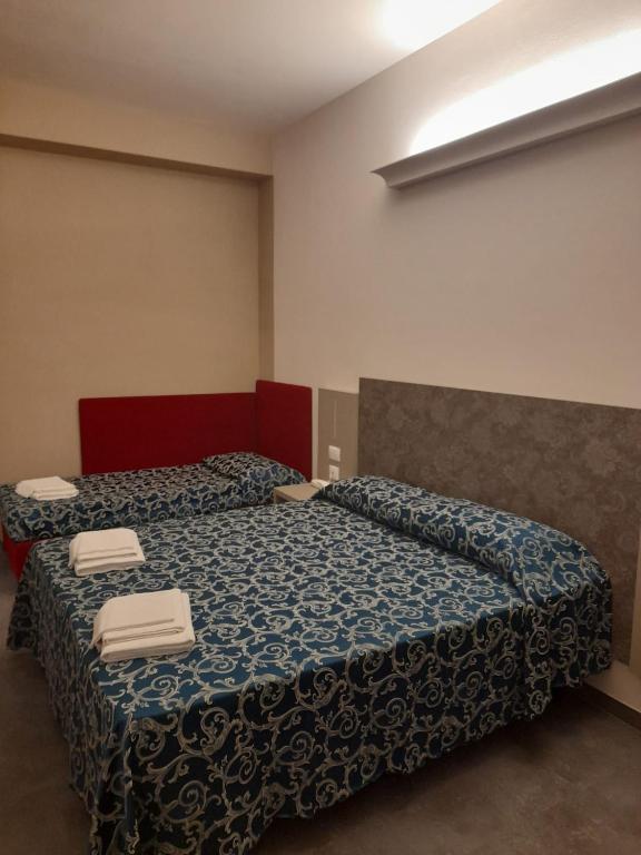 Postel nebo postele na pokoji v ubytování Hotel 2000