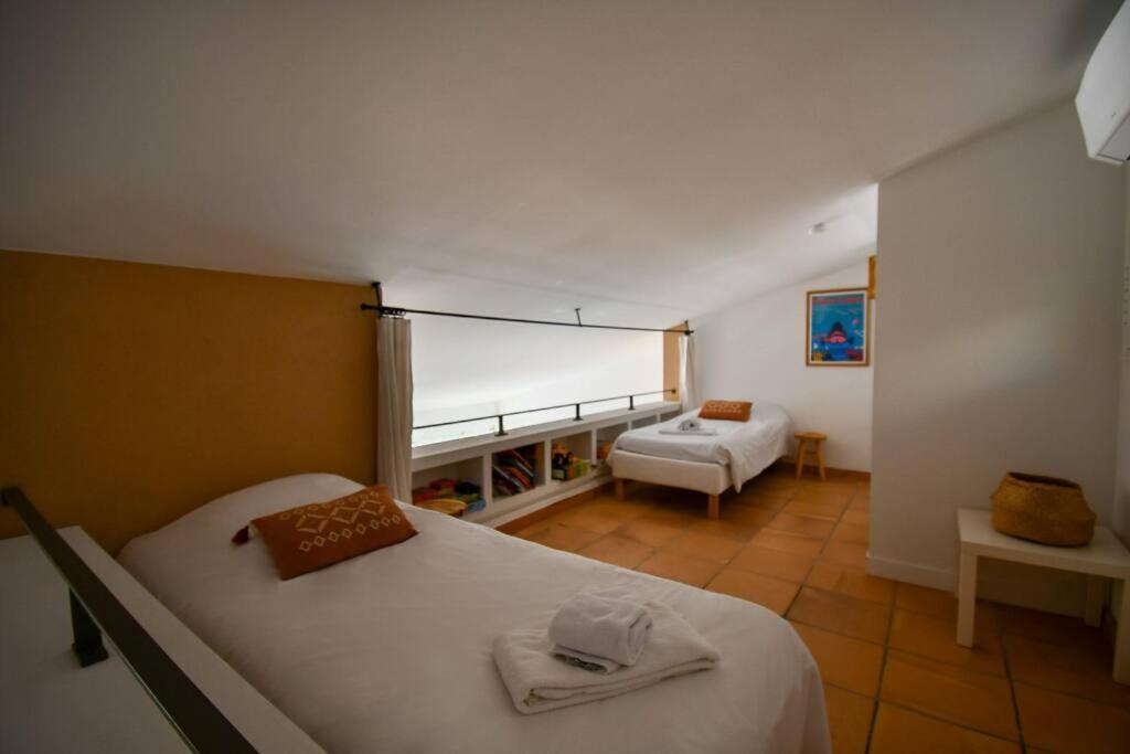 En eller flere senge i et v&aelig;relse p&aring; Villa Palm Springs Superb Sea View, Terrasse and Swimming Pool