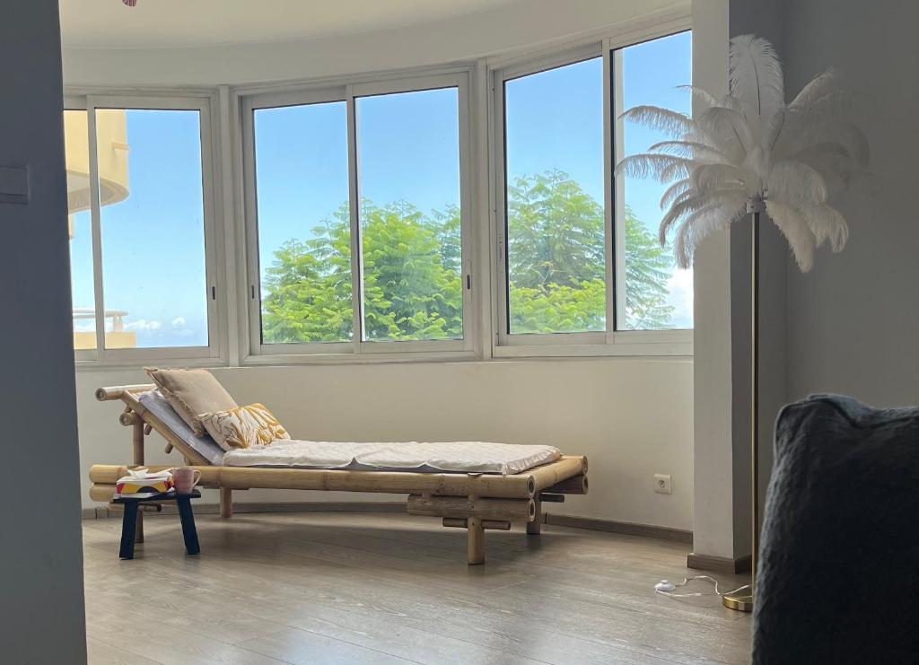Predel za sedenje v nastanitvi Aprile des îles .Appartement avec une jolie vue