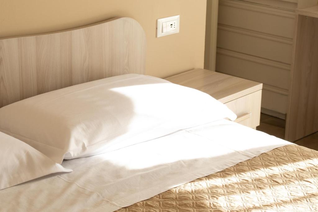 Postel nebo postele na pokoji v ubytování Bed & Breakfast Nonno Gigi - Falerna Marina