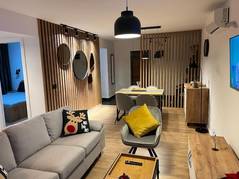 a living room with a couch and a table at Apartament Suceava in Suceava