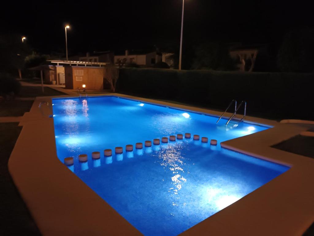 a swimming pool at night with lights on it at Bella Hermosa in Jávea