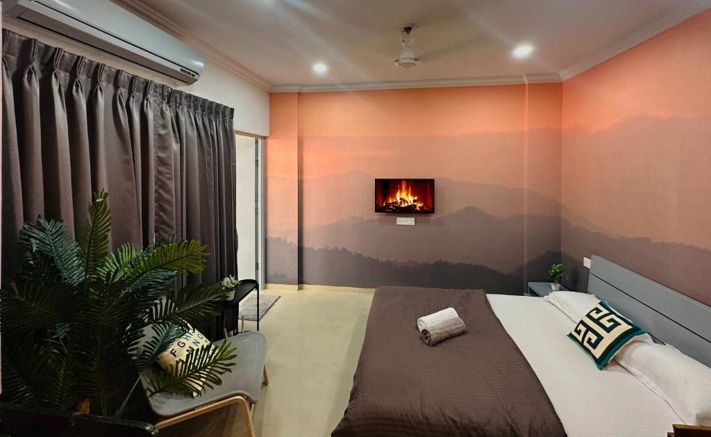 a bedroom with a bed and a fire in the wall at The Good Vibes Studio : AC, WiFi, Smart Tv in Pune