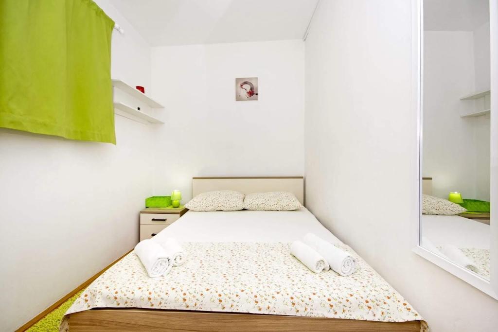 Postel nebo postele na pokoji v ubytování Apartman Makarska