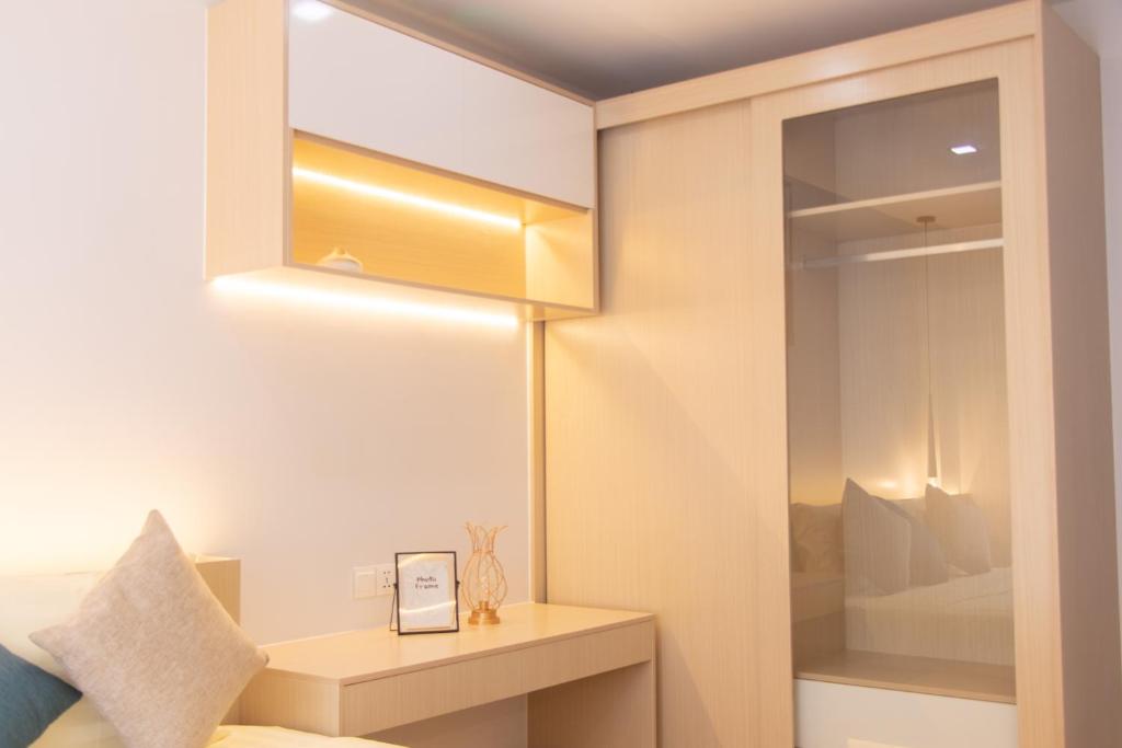 Postel nebo postele na pokoji v ubytování Sky Park Condotel & Residence